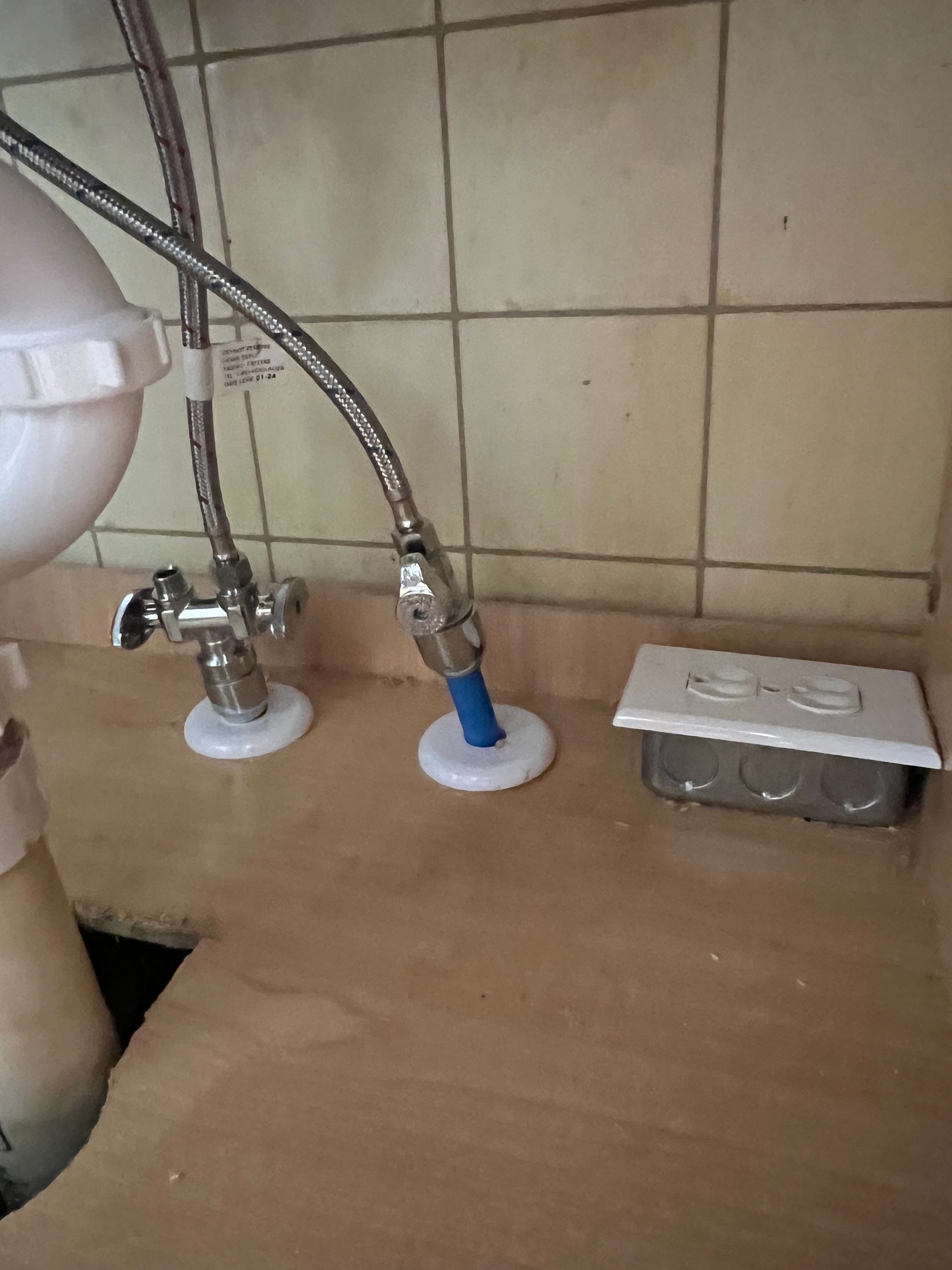 A sink with a garbage disposal underneath it