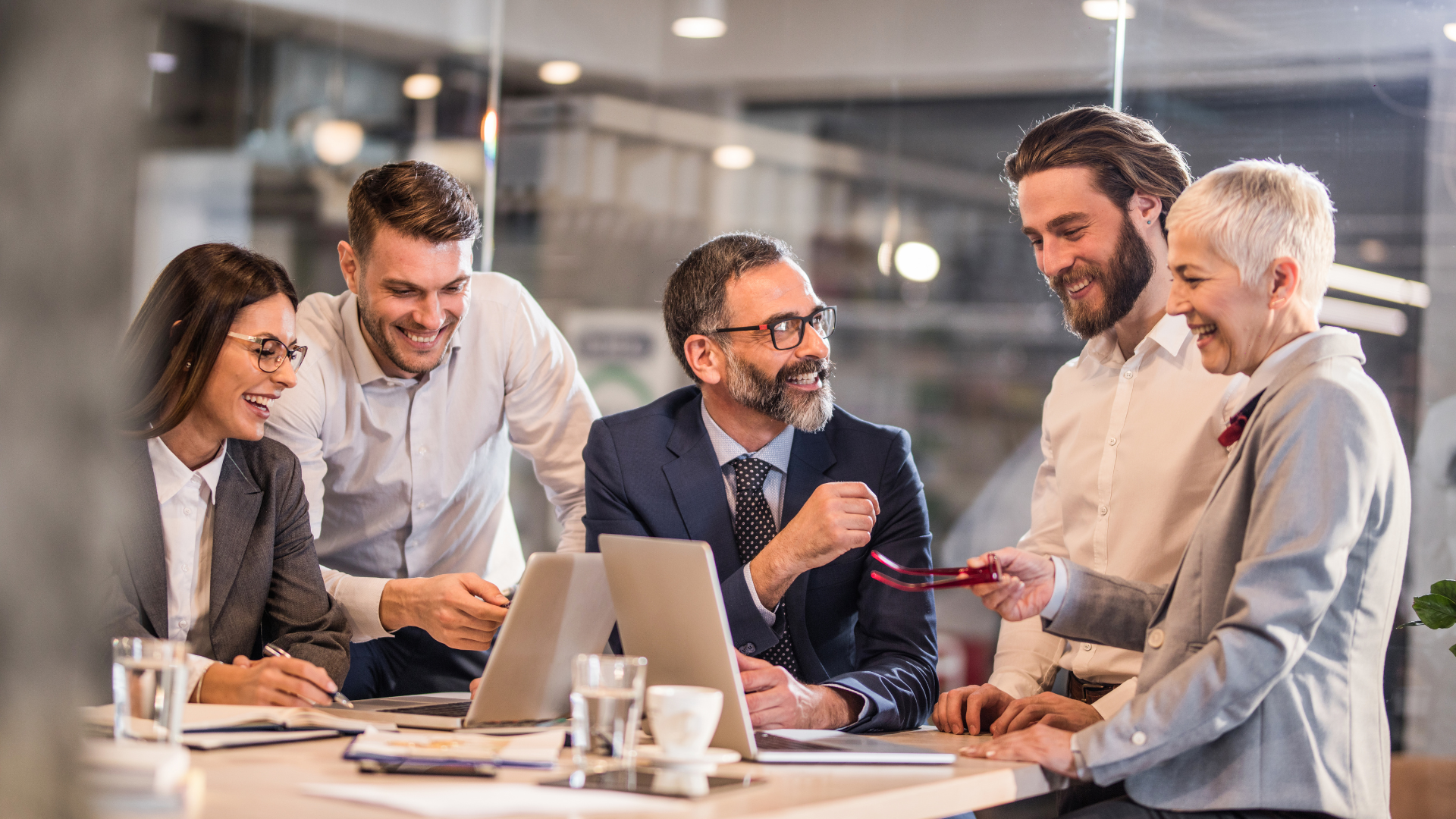 A group of business people are having a meeting in an office