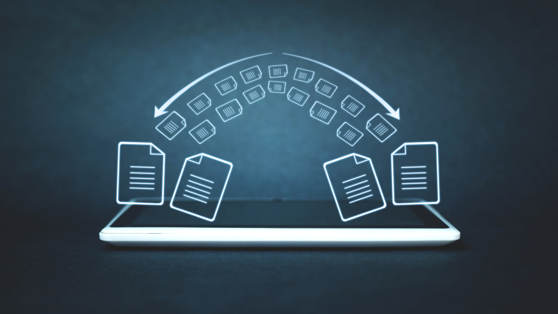 A tablet with a bunch of papers coming out of it