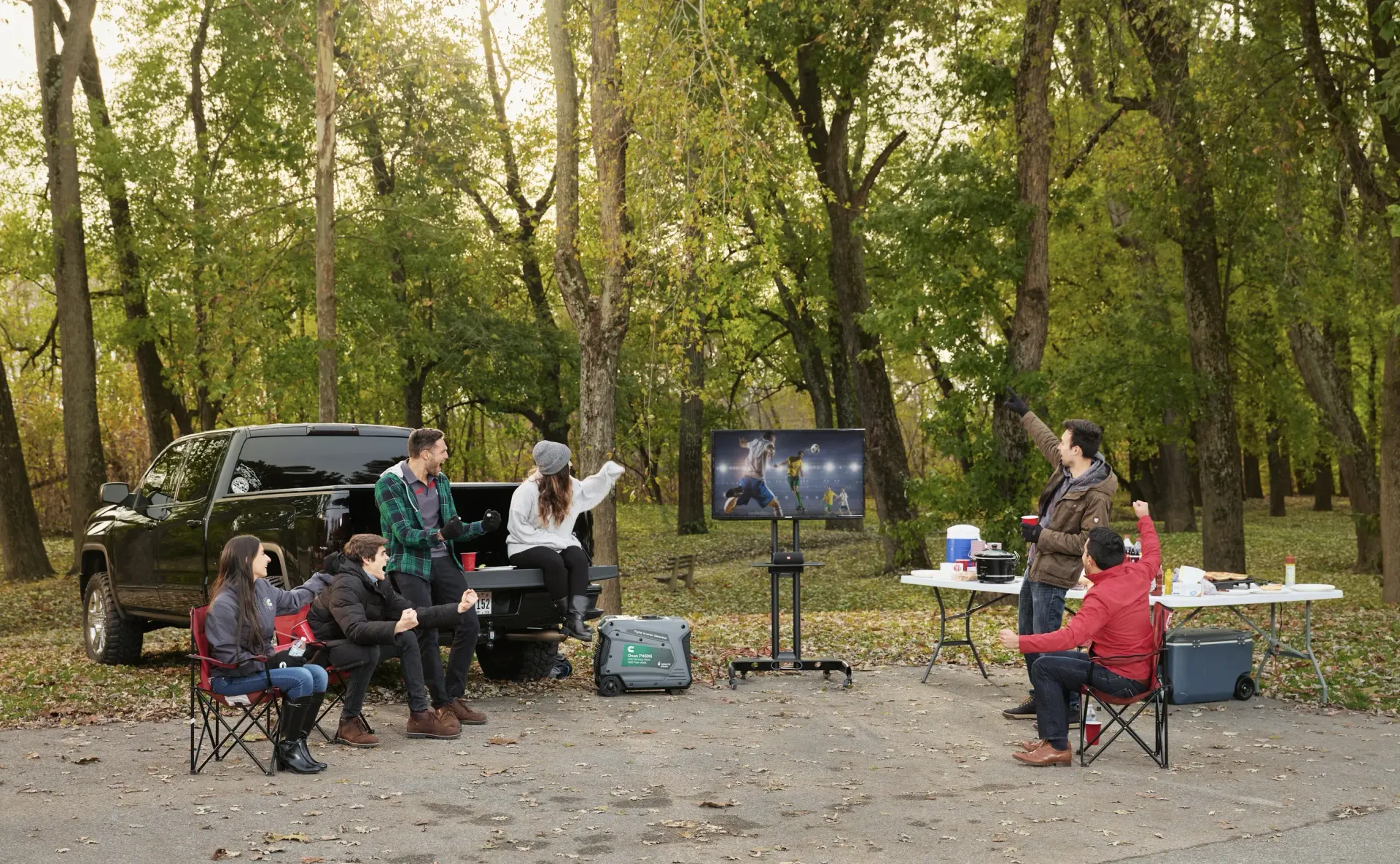 People Outdoors watching T.V. with a Portable Generator