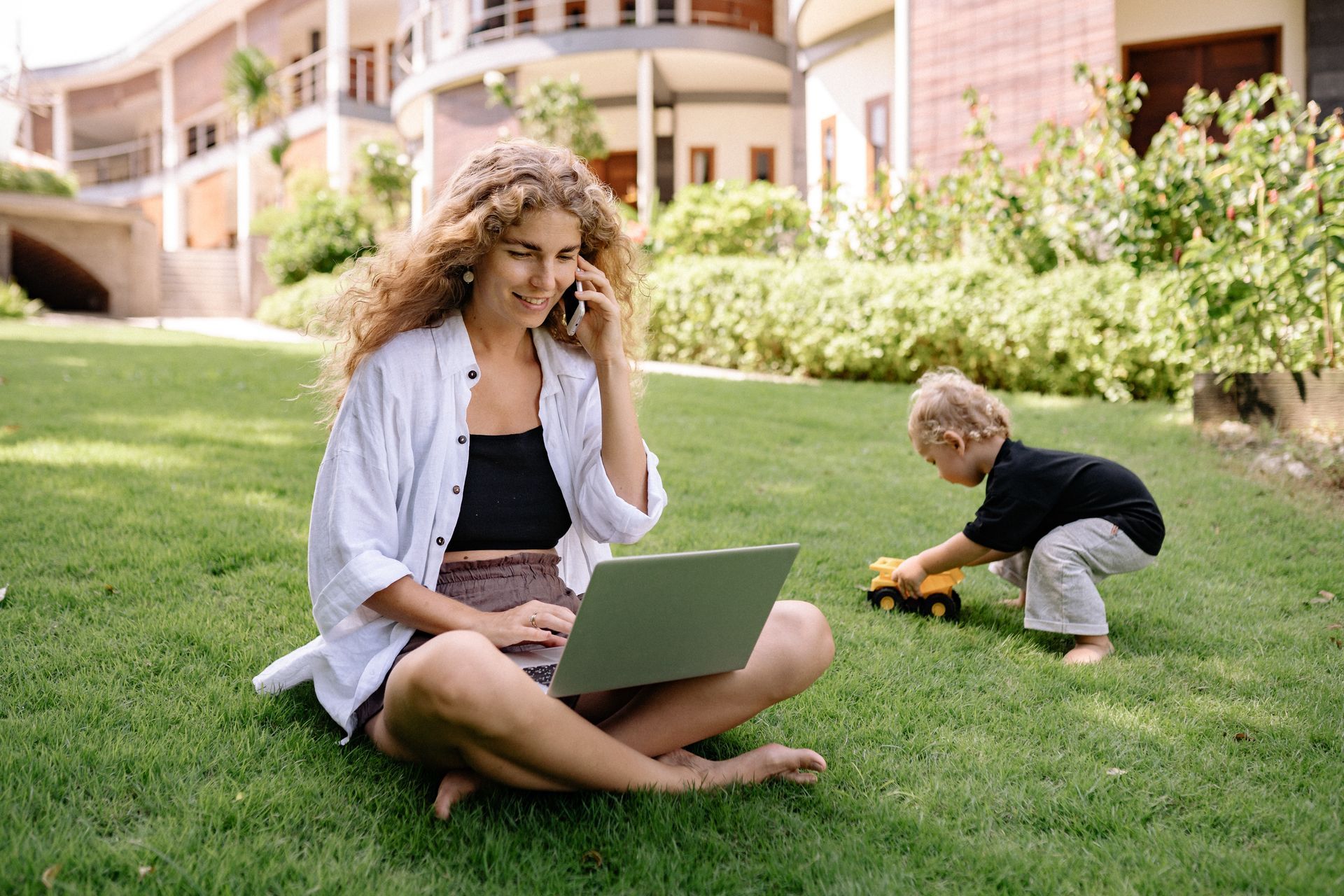 woman in park on laptop