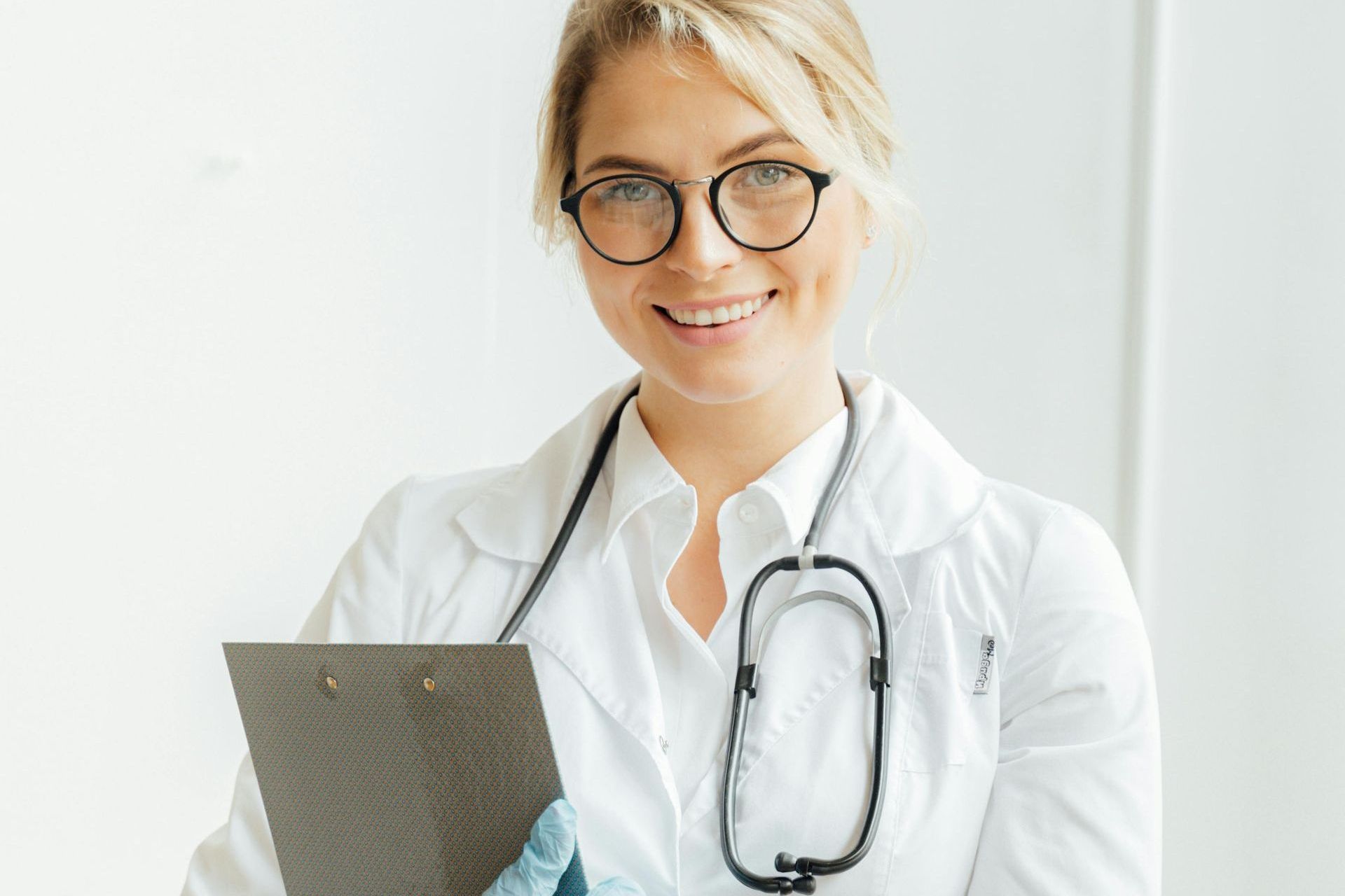 A female doctor is using a tablet computer in a hospital.