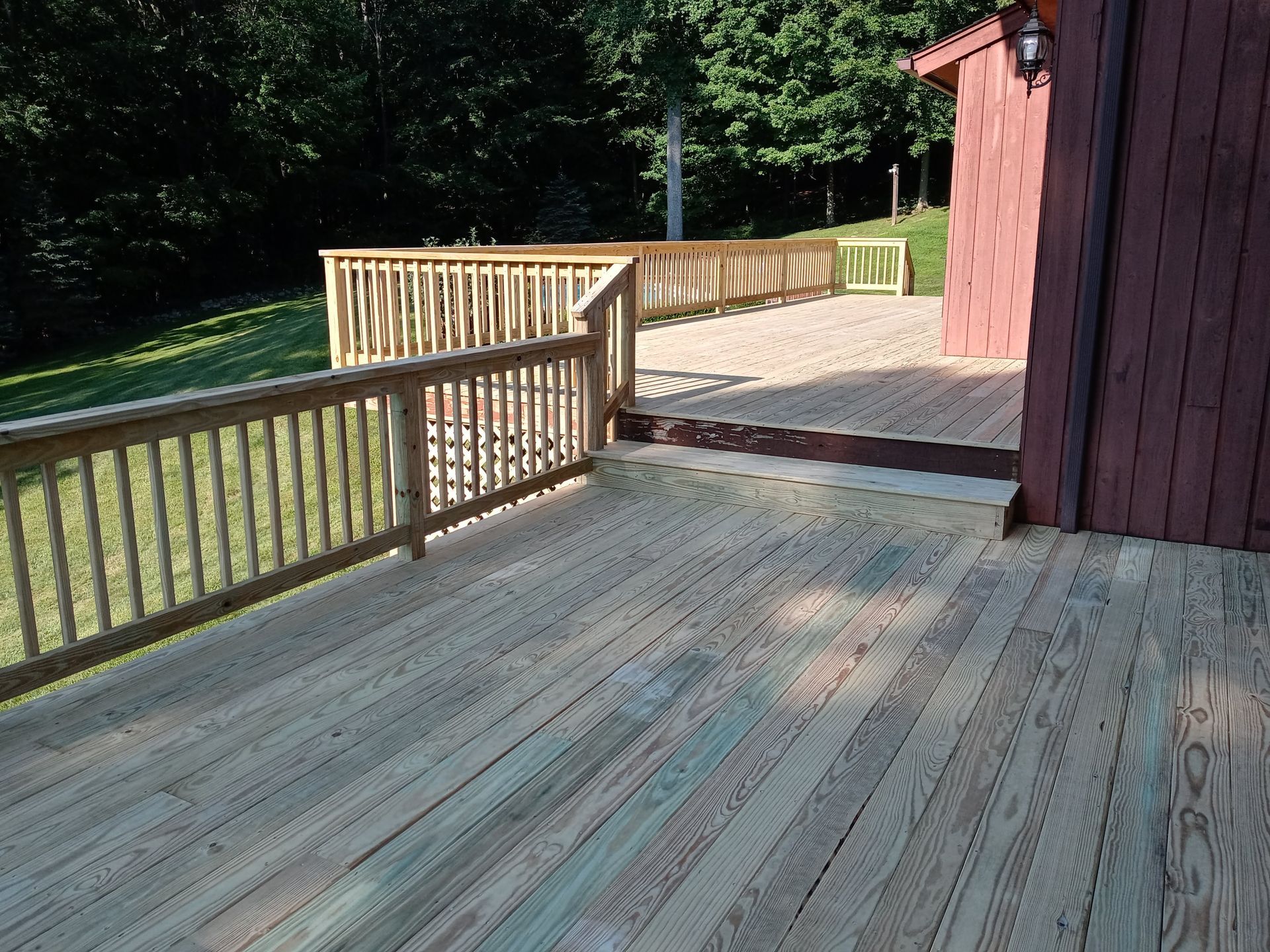 A wooden deck with stairs leading up to it