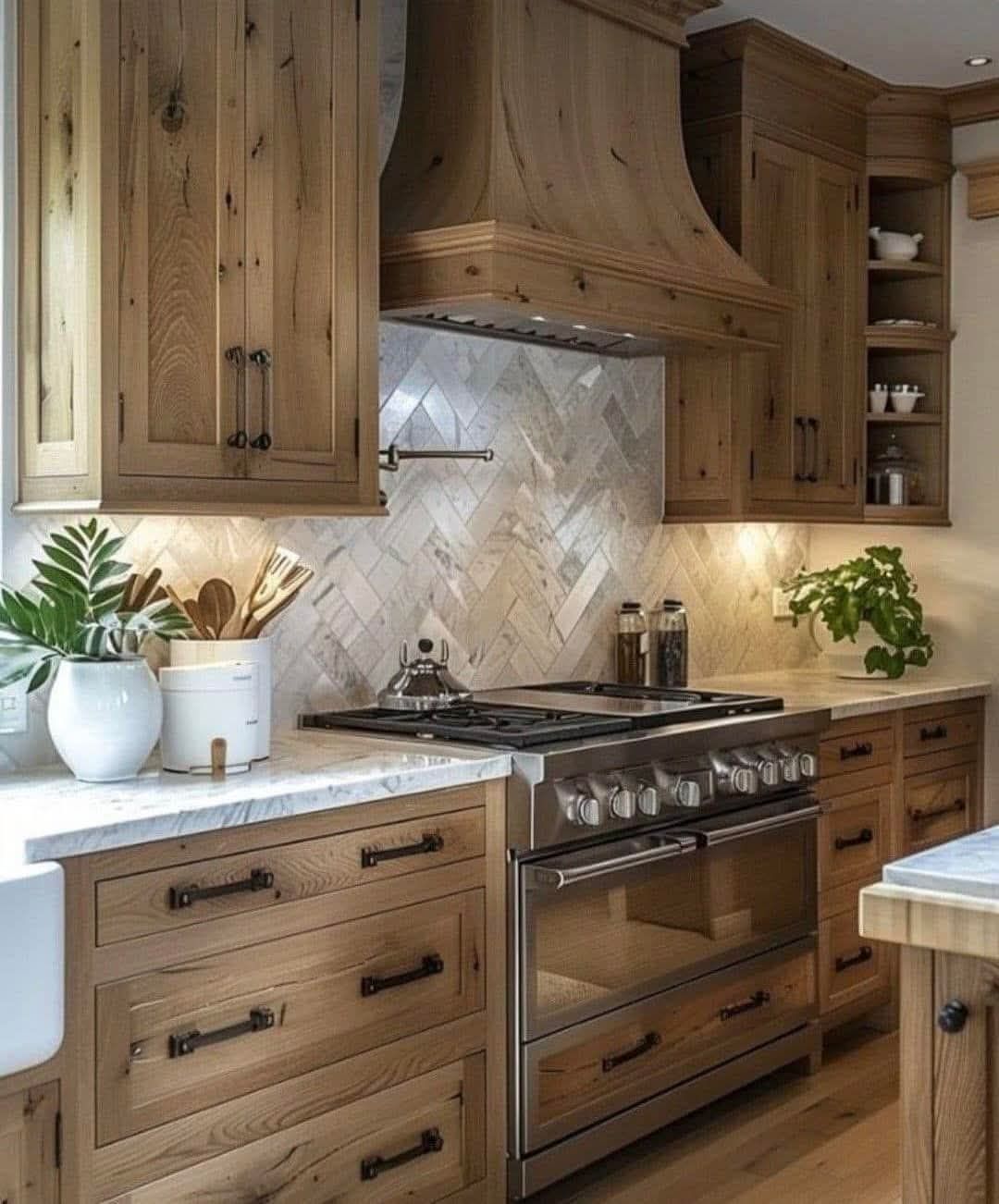 A kitchen with wooden cabinets , stainless steel appliances , a stove and a sink.