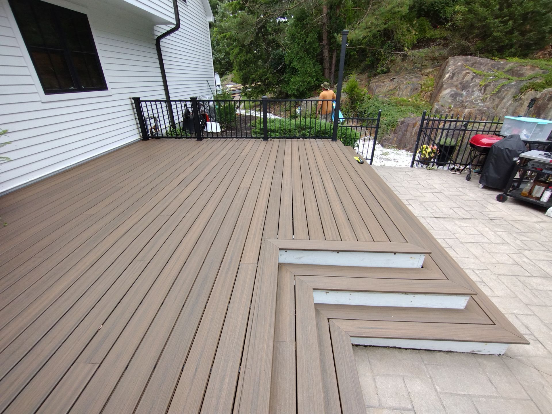 A wooden deck with stairs leading up to it