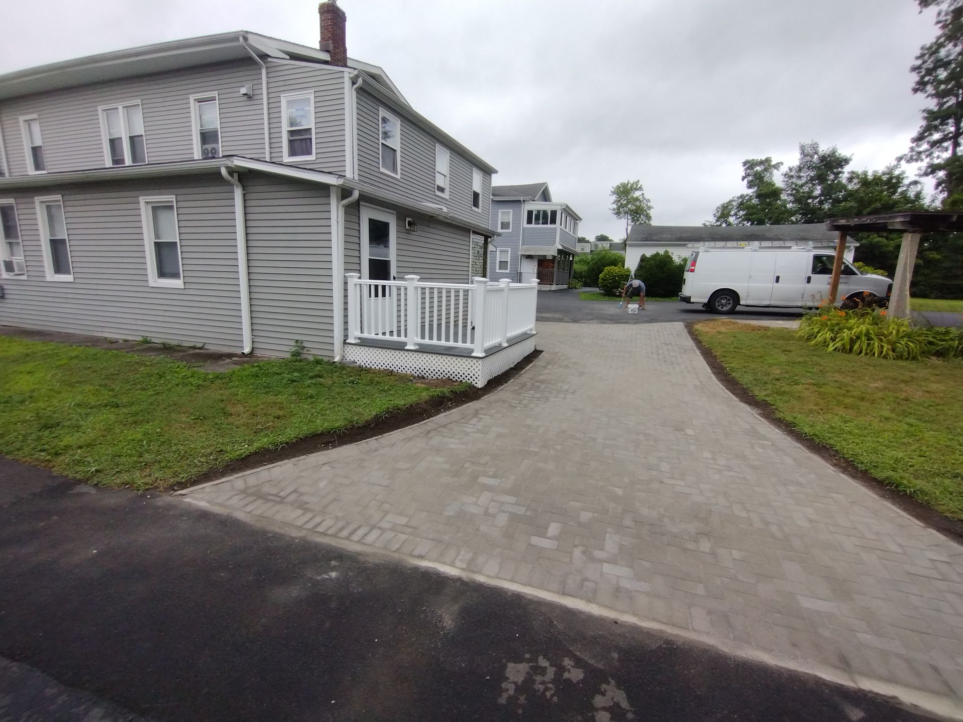 A house with a white van parked in front of it
