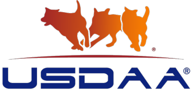 Logo of USDAA with three running dog silhouettes in orange hues above the blue wordmark.