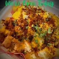 A close up of a plate of food with cheese and bacon.