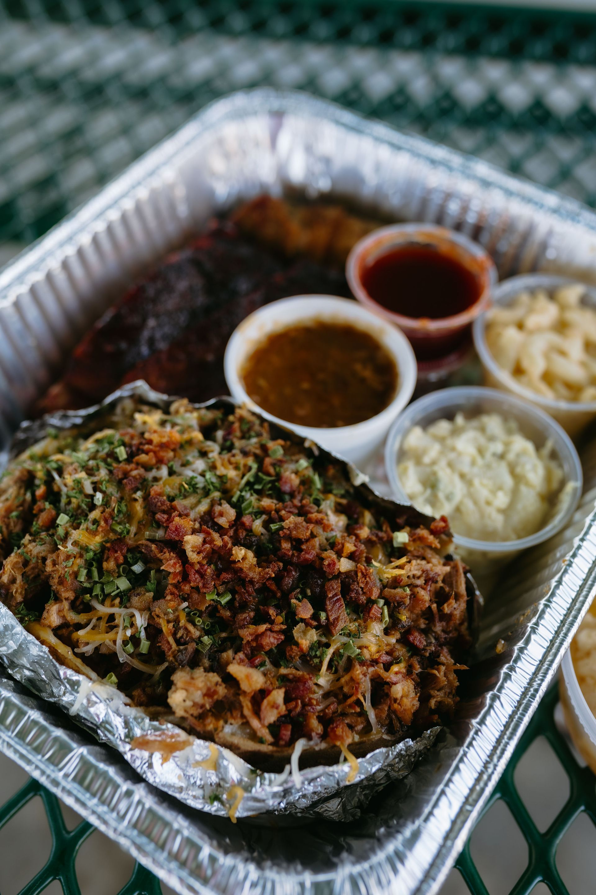 A person is holding a plate of food in their hands.