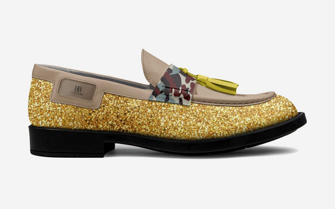 Glittery gold loafer with a floral accent and yellow tassel.