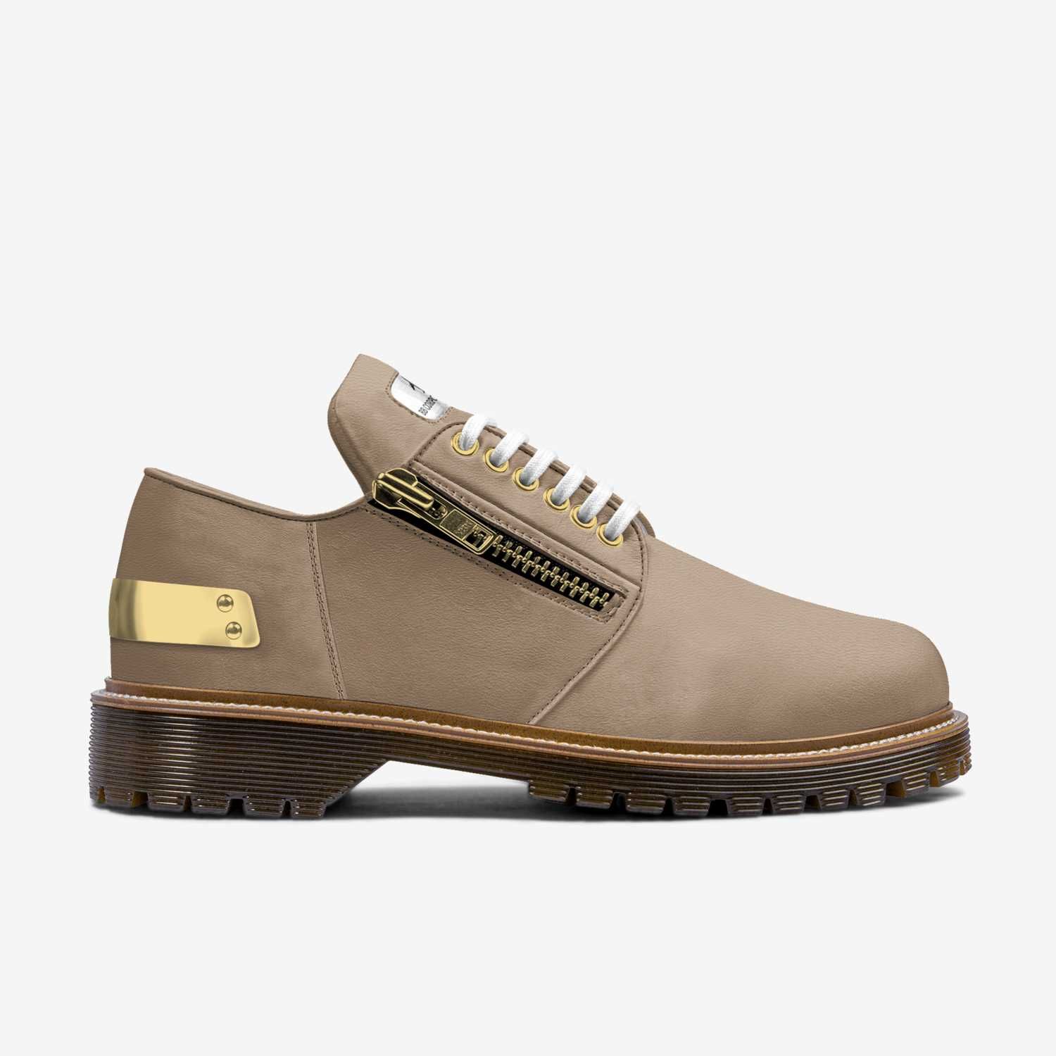 Taupe suede shoe with a zipper, gold accents, and a brown lug sole.