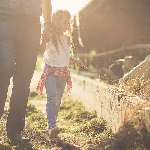 family at farm feedlot