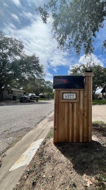 Wooden mailbox with address 