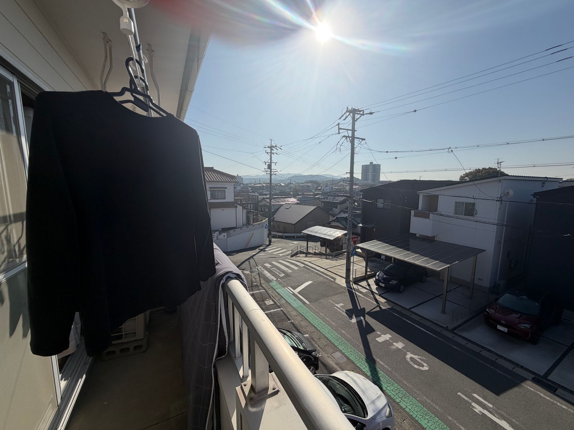 balcony with drying laundry in sunshine