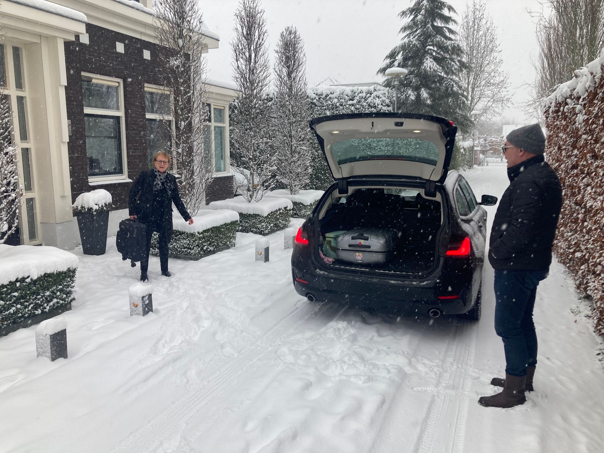 Holland in the snow. Leaving house with taxi