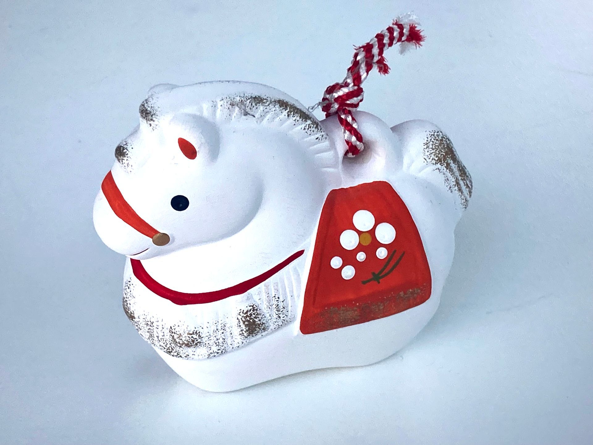 Small porcelain statue of a horse because 2026 is th eyer of the horse