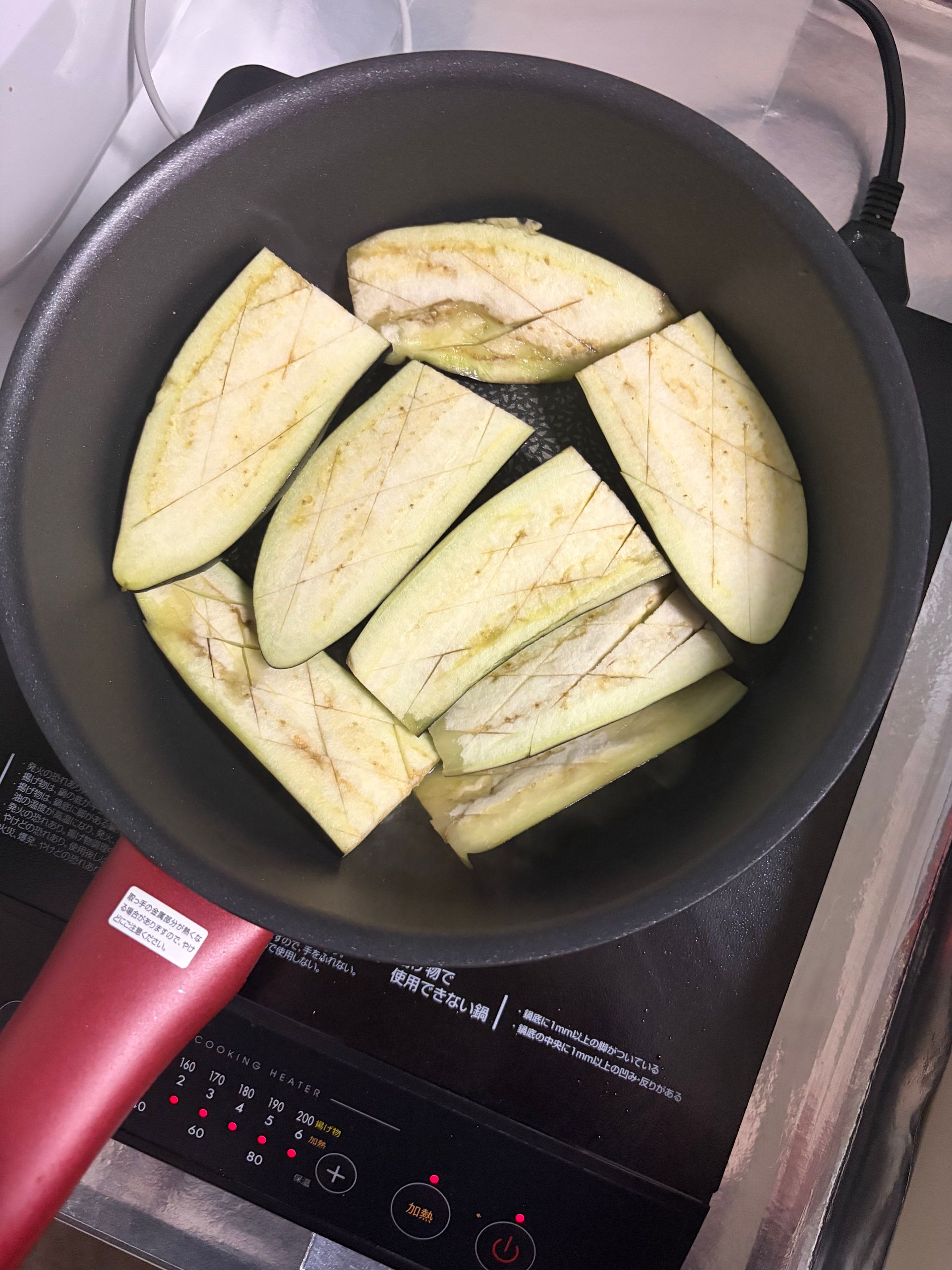 eggplant on skin side in frying pan