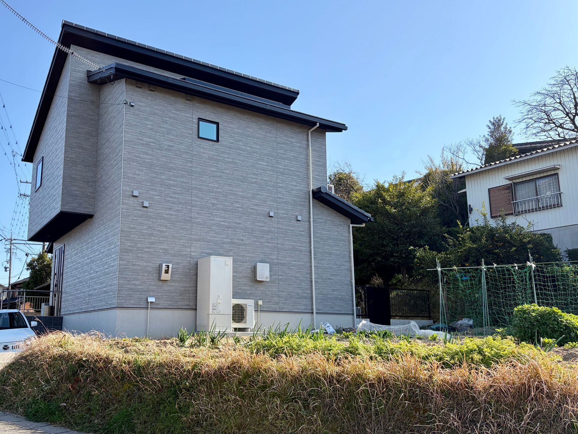 Japanese pre fab house with hardly any visible windows