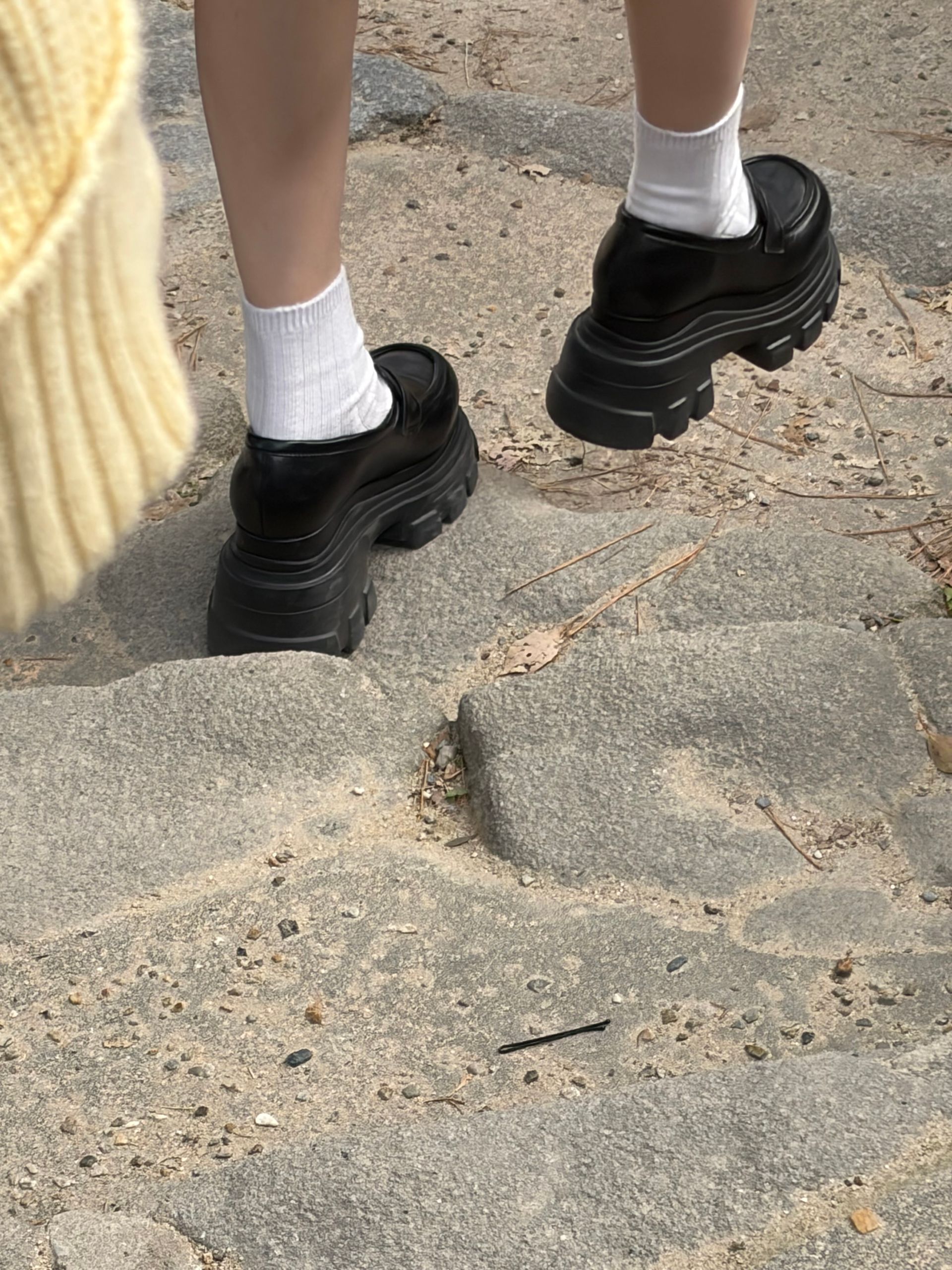 tiny legs in huge shoes