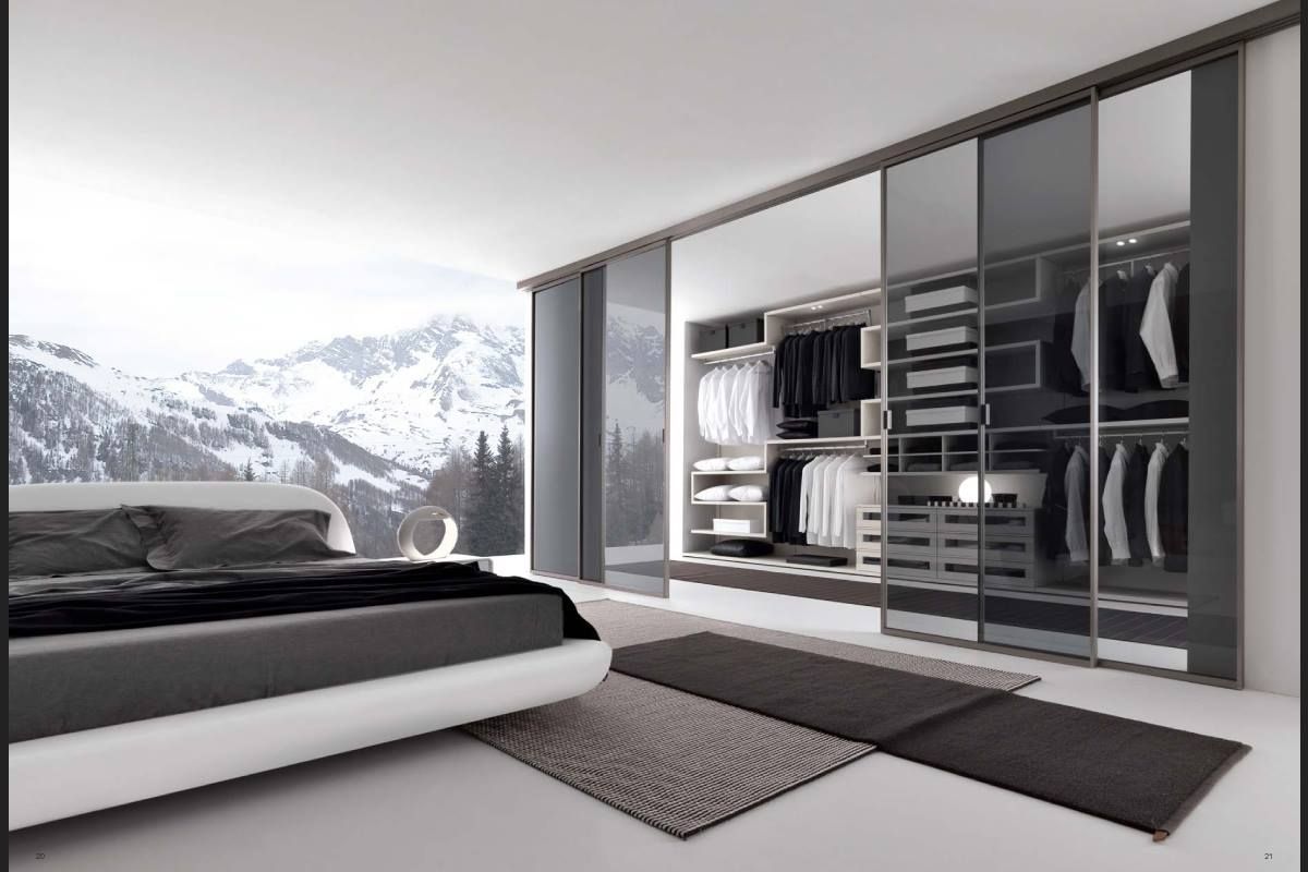 A Bedroom with A Bed and A Mirrored Wardrobe — Roll Edge In Manunda, QLD