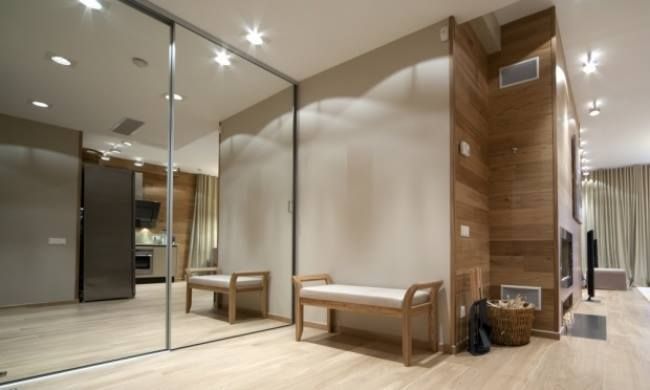 A Hallway with A Large Mirror on The Wall — Roll Edge In Manunda, QLD