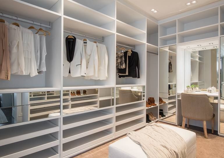 A Walk in Closet with Lots of Shelves and Mirrors — Roll Edge In Manunda, QLD