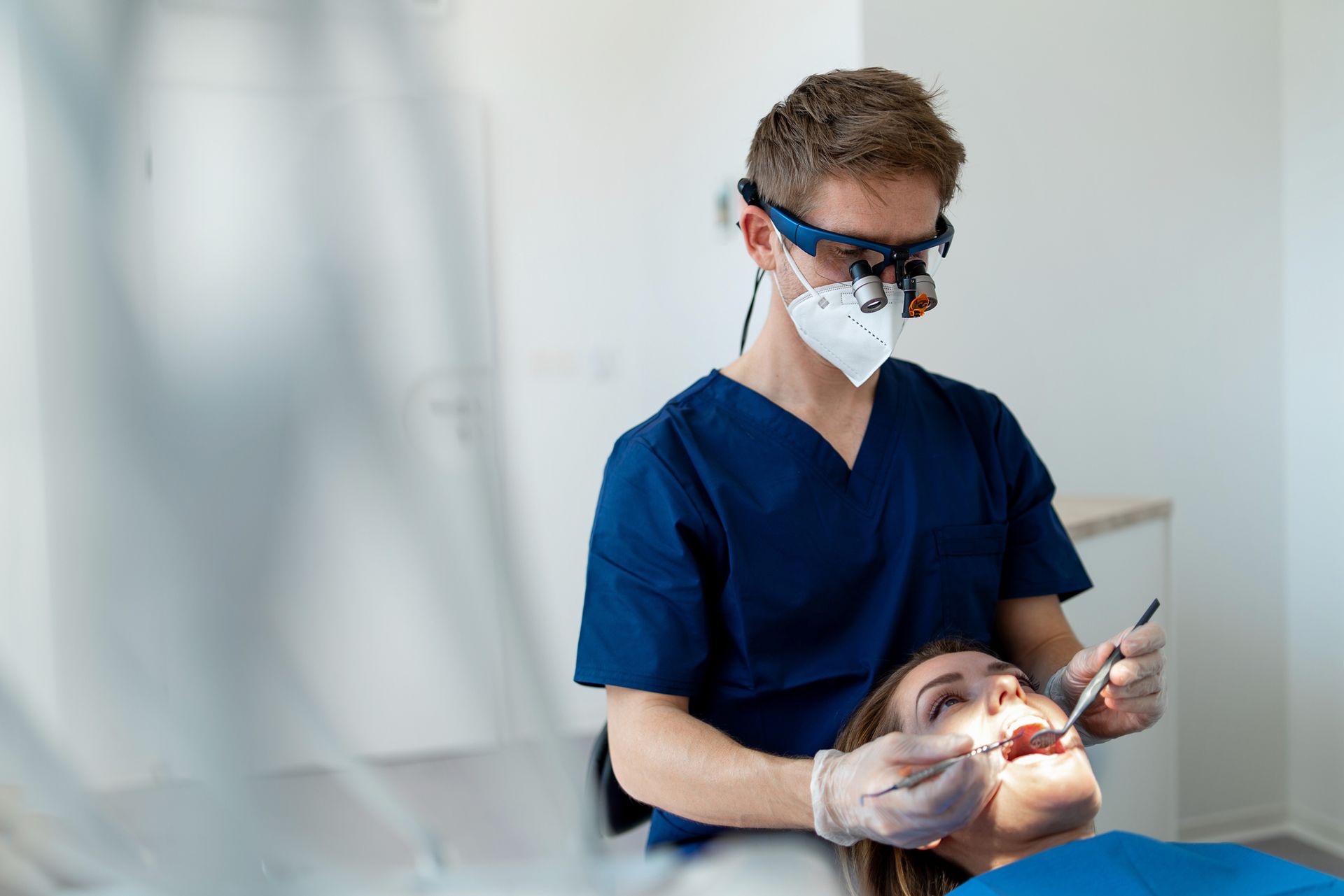 Dentist checking patient's teeth