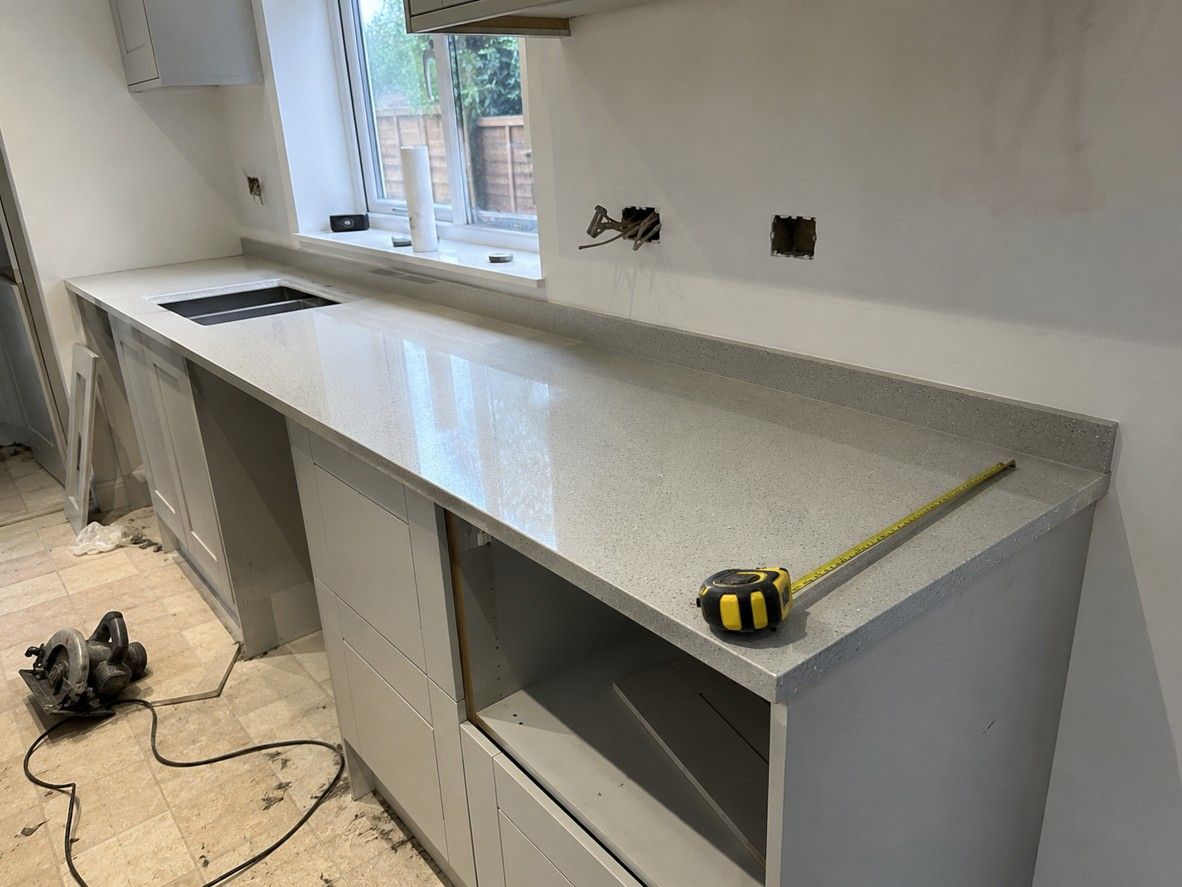 Kitchen worktop being measured and fitted by Derbyshire Joinery Specialists during a Matlock kitchen installation