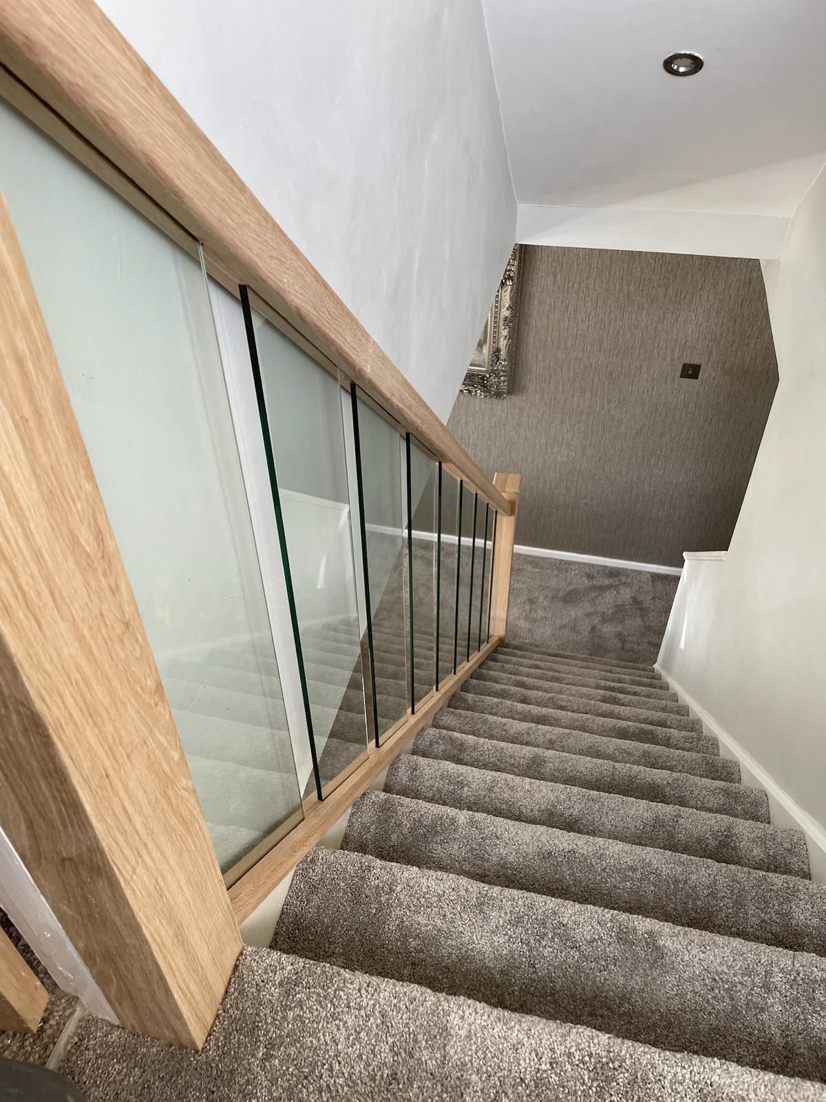 Derbyshire Joinery Specialists oak clad staircase with glass balustrades in Derby