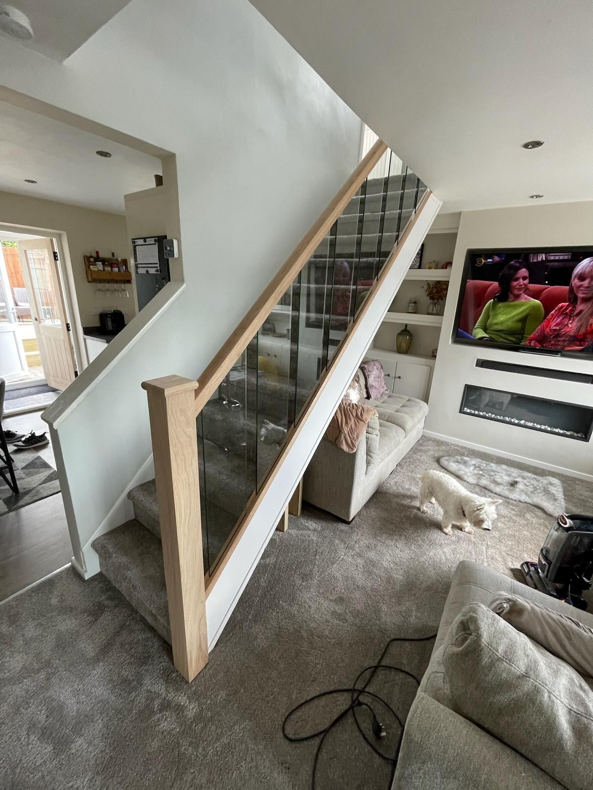 Derbyshire Joinery Specialists an oak hand and base rail was fitted to for the staircase with 12 mm glass