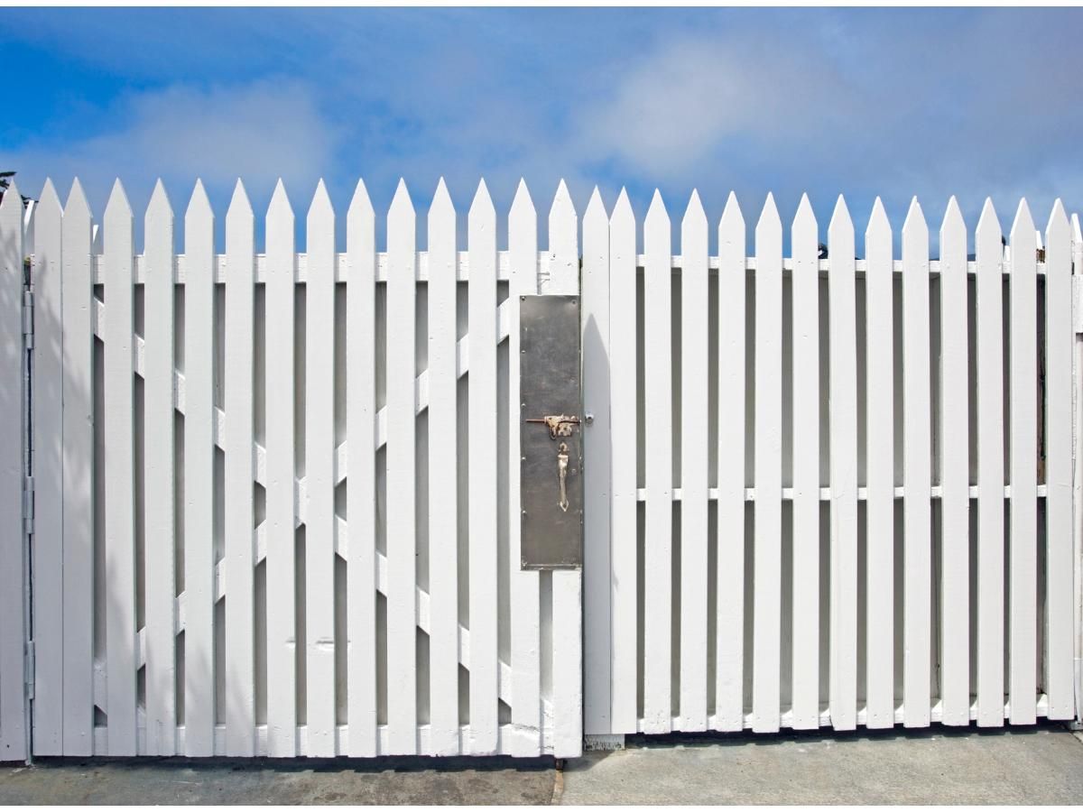 White painted wooden double driveway gates