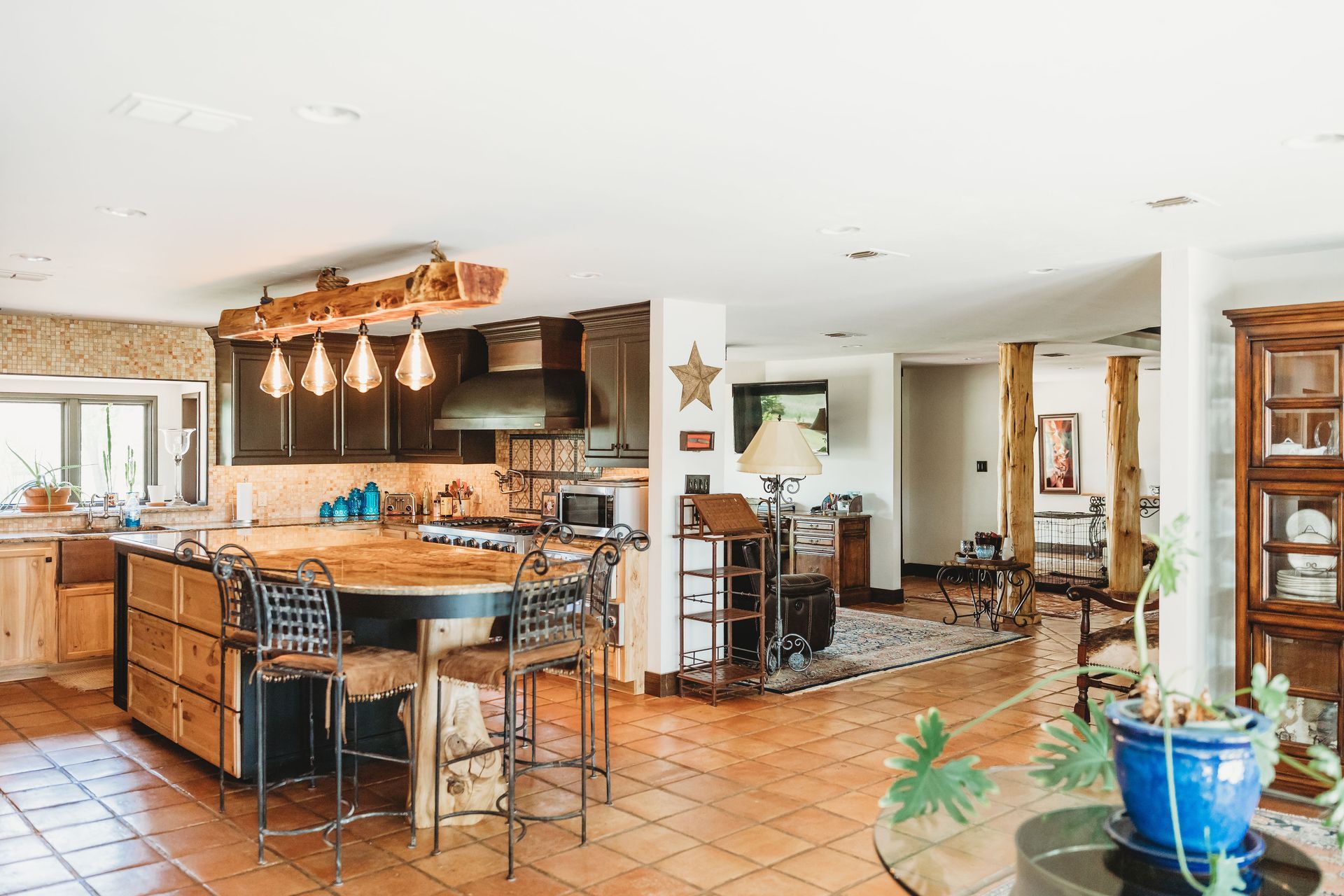 A large kitchen with a large island in the middle of the room.