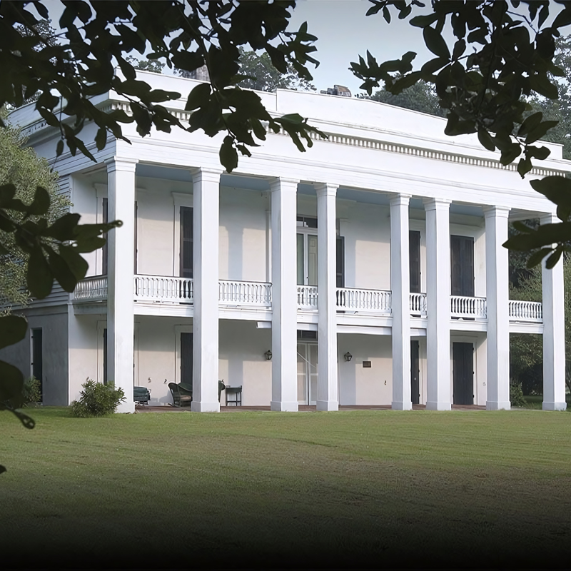 A large white house with columns and balconies