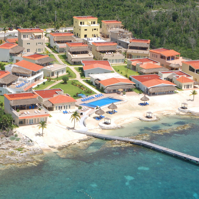 An aerial view of a beach resort with a swimming pool