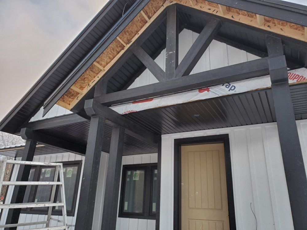 All black fascia and custom wood window trim for a new house in Kelowna