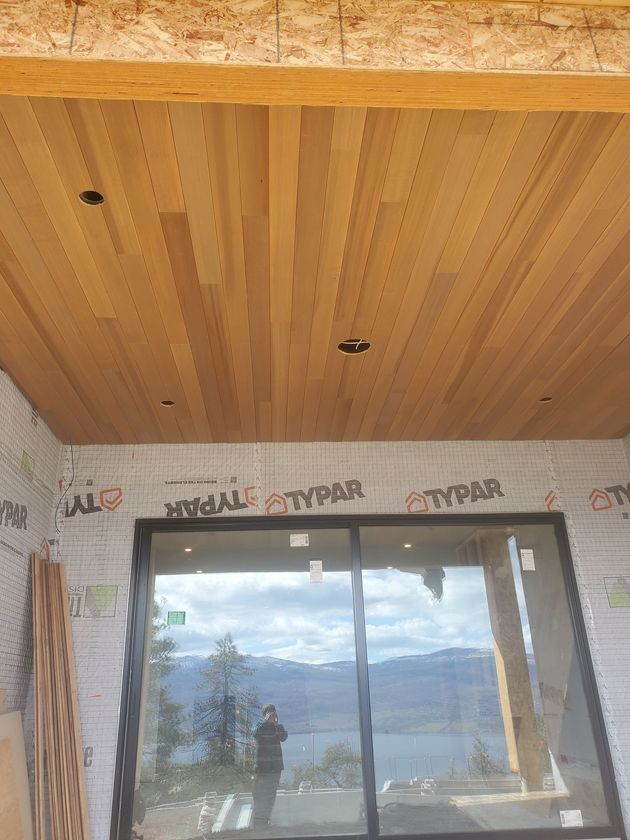 Oak and maple soffits for a custom house build in West Kelowna