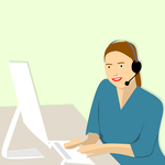 Picture of a remote assistance women wearing a headset talking to a client while working on her computer.