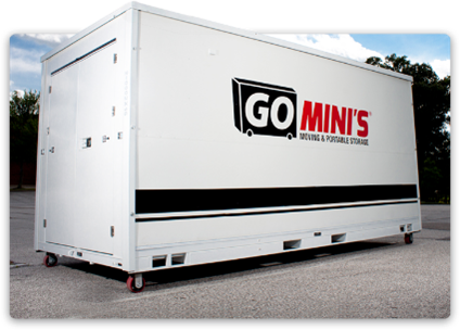 A white Go Mini's portable moving and storage container with black accents, parked on pavement.