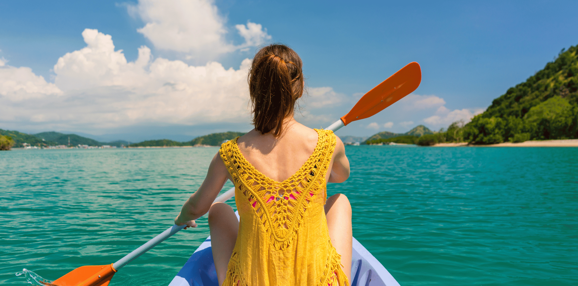 A girl paddling a canoe