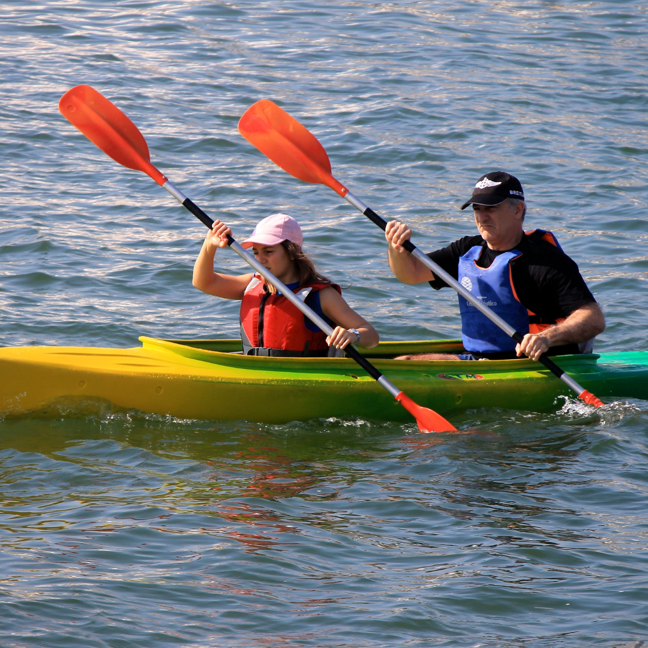 Man an a girl in a canoe