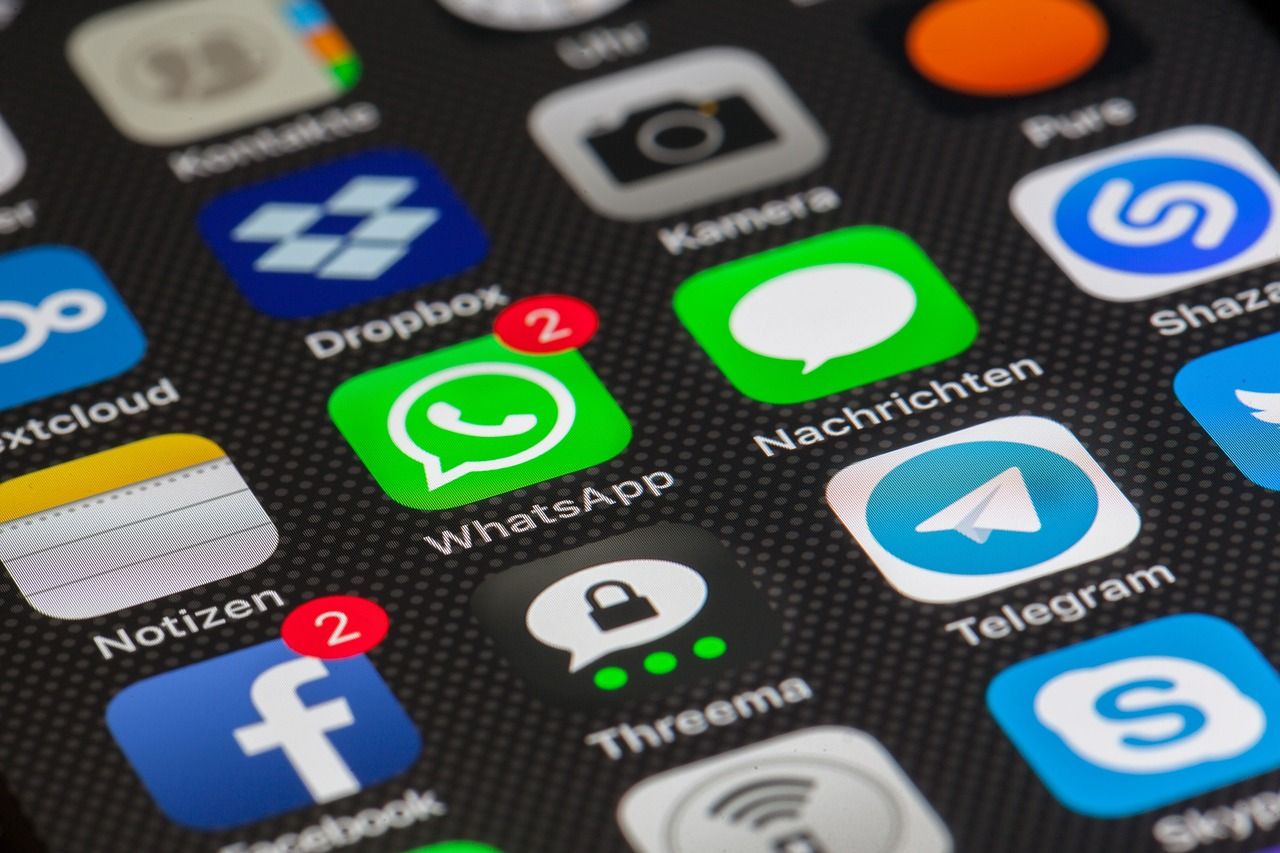 A close up of a cell phone screen with many apps including whatsapp and telegram