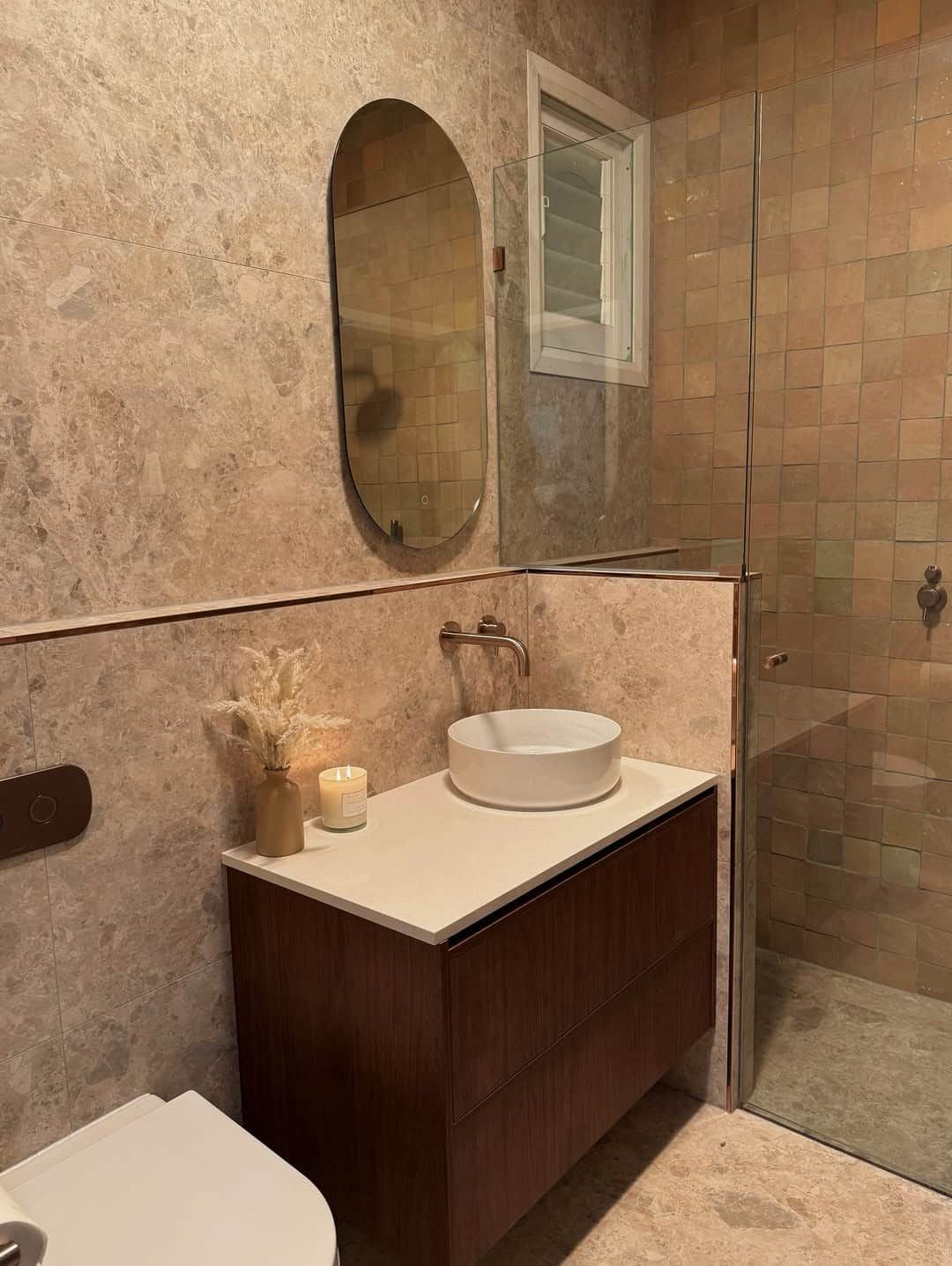A Modern Bathroom Featuring a White Vessel Sink on a Dark Wood Vanity — Crystal Clear Plumbing & Roofing in Wollongong, NSW