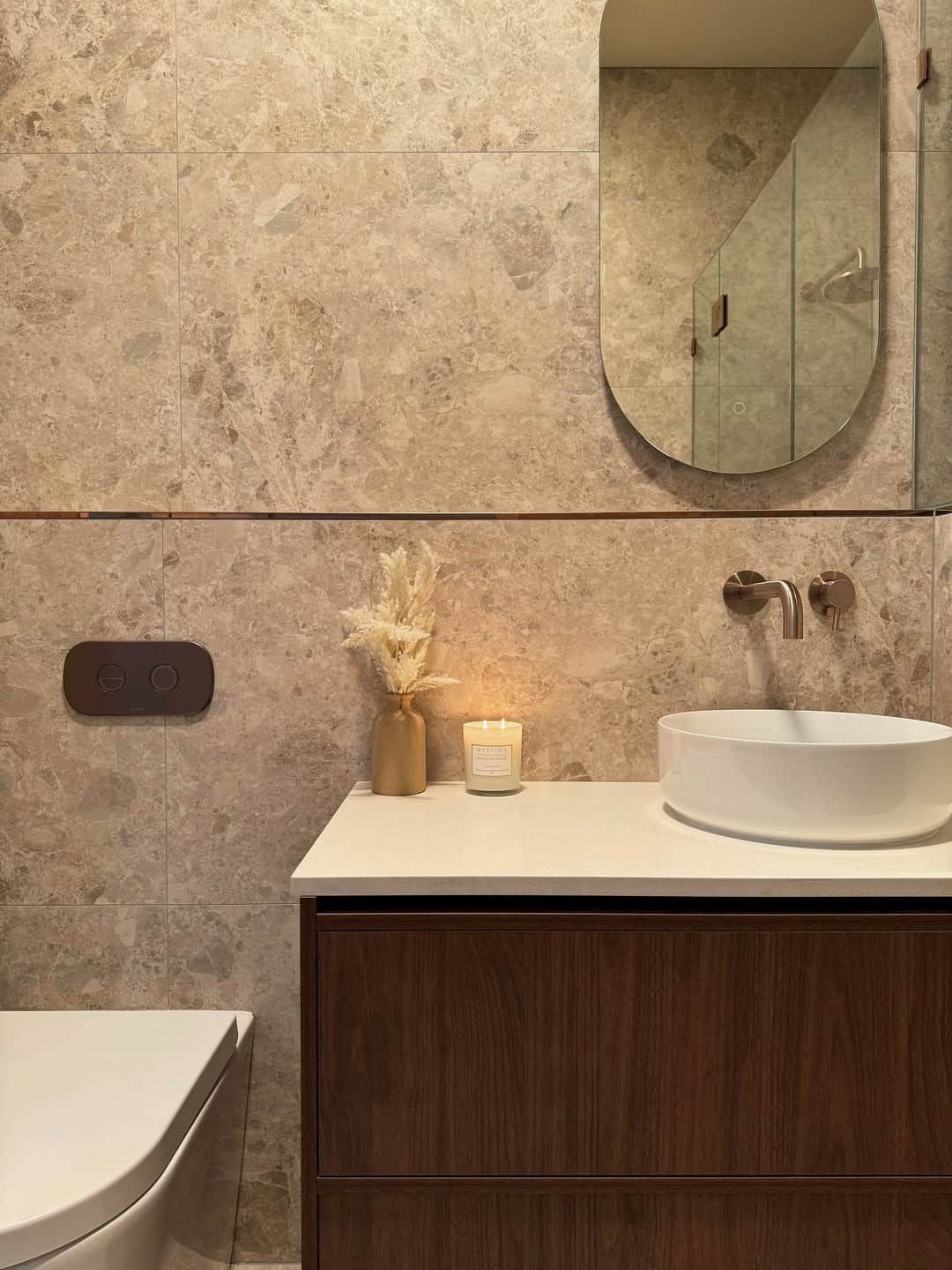 A Modern Bathroom With Light Stone-textured Walls, a Walnut Vanity — Crystal Clear Plumbing & Roofing in Austinmer, NSW