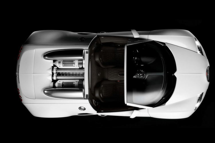 an aerial view of a white sports car with the top down