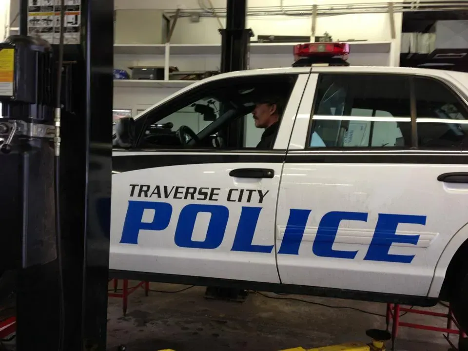 A traverse city police car is sitting on a lift