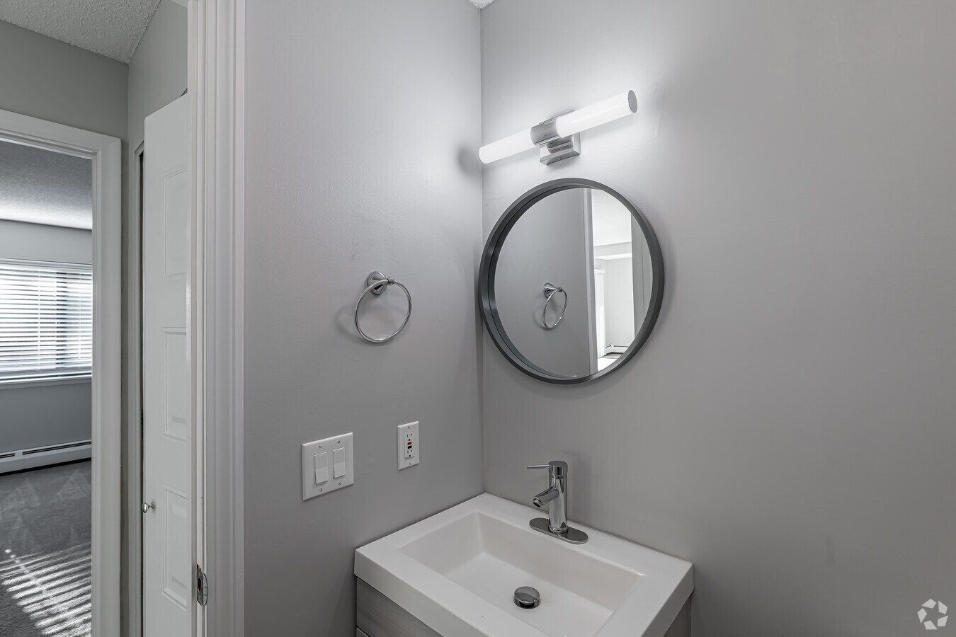 Renovated bathroom vanity in a one-bedroom Avon Woods apartment