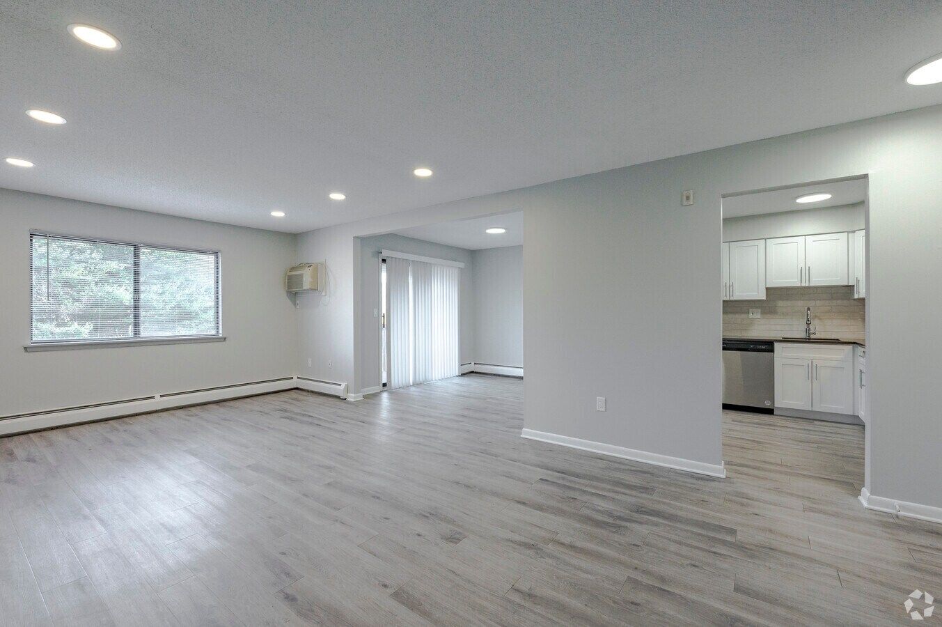 Open living and dining area in a renovated Avon Woods apartment
