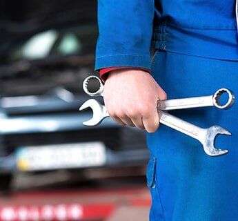Car Mechanic With Wrench - State Inspections in Harrisburg, PA