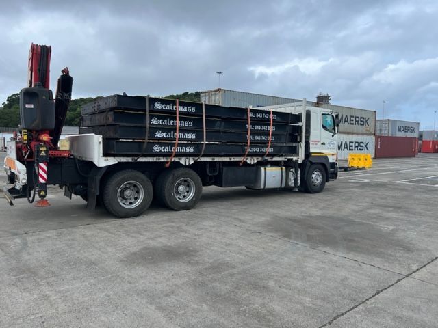 A maersk truck is parked in a parking lot.