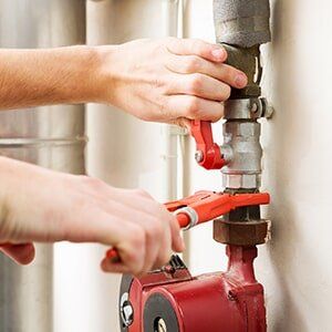 Plumber adjusting pipeline — general plumbing in Stuart, FL
